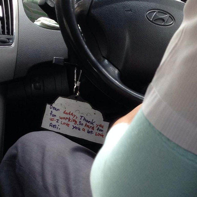 Seen hanging from the steering column of a taxi cab