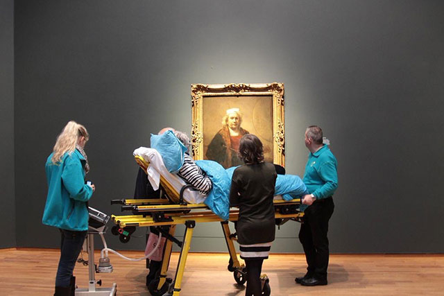 A woman enjoys the Rijksmuseum one last time
