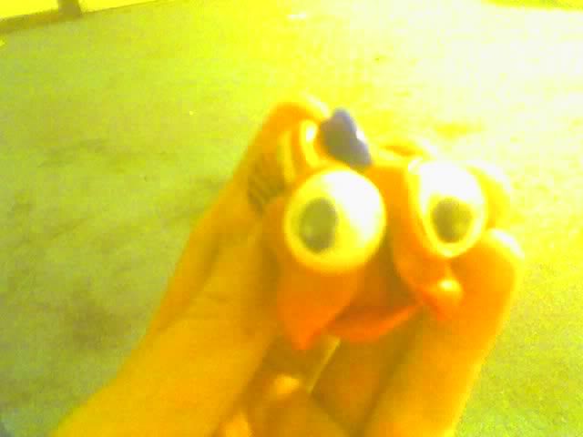 This is a crappy cell phone camera picture of a kids' meal toy I found in the back of my sister's car last spring.  The temperature hadn't even gotten to 100 degrees yet, but the sun still managed to do this.  I'm not even sure what character this was supposed to be.