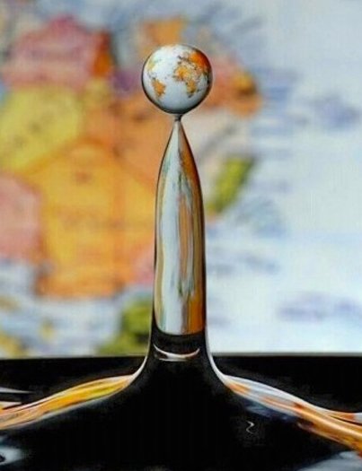 Water Drop In Front of a World Map