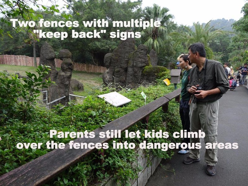 clinical reasoning - Two fences with multiple "keep back" signs Parents still let kids climb over the fences into dangerous areas