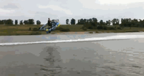GIF of a man using a boat to fly