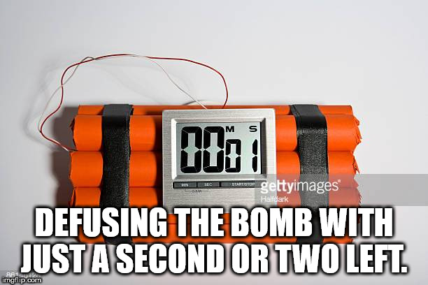 dinamite - gettyimages Halfdark Defusing The Bomb With Just A Second Or Two Left. imgflip.com