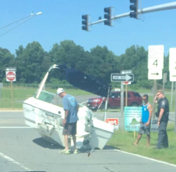 crashed boat on road