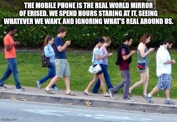 group of people walking down the street looking at their phones - The Mobile Phone Is The Real World Mikrol Of Erised. We Spend Hours Staring At It, Seeing Whatever We Want, And Ignoring What'S Real Around Us.