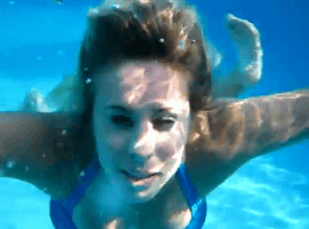 woman underwater bubbles