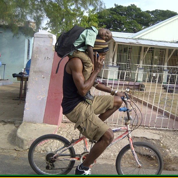 A Jamaican dad shows fatherly skills