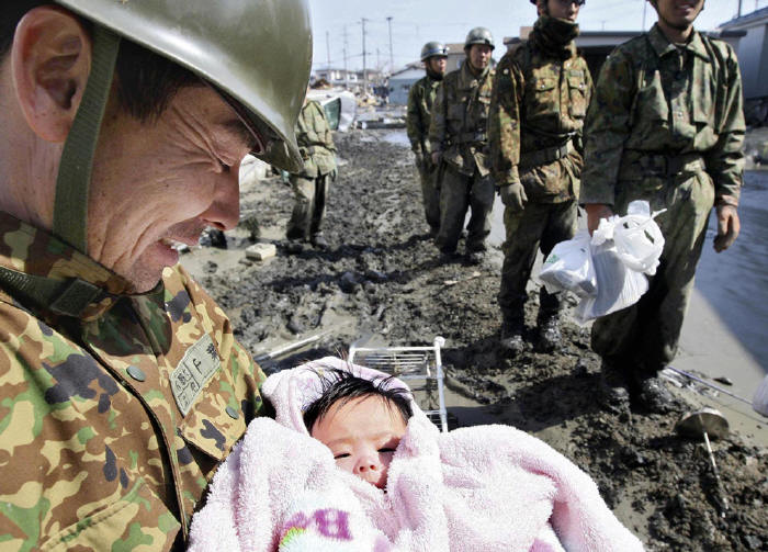 A four month-old baby is found miraculously in the rubble four days following the 2011 Japanese Tsunami.