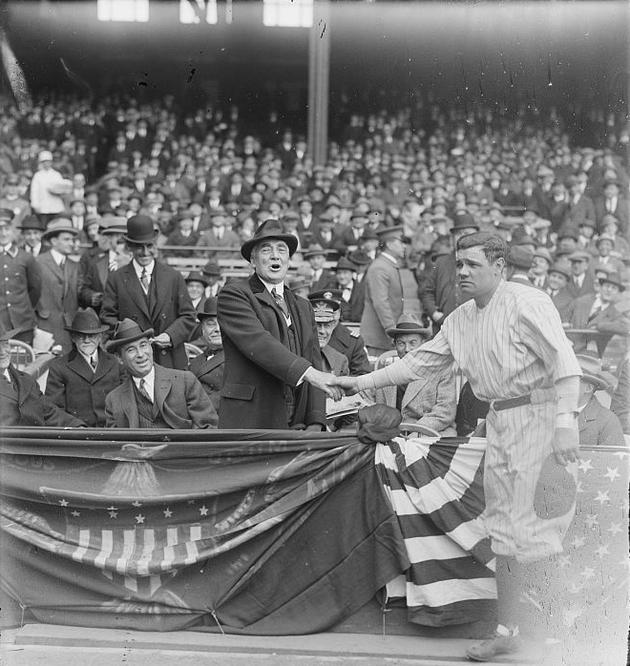 Babe Ruth shakes hands with U.S. President Warren G. Harding during a game at the Yankees Stadium. April, 1923. Ruth set career records for home runs which totalled at 714!