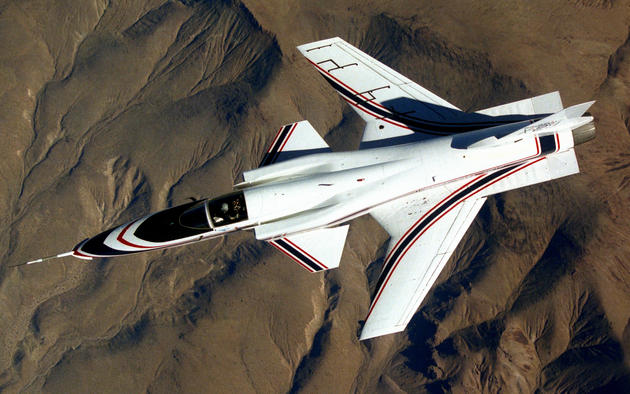 A Grumman X-29 experimental aircraft. It was engineered to test a forward-swept wing, canard control surfaces, and other novel aircraft technologies. The aerodynamic instability of this arrangement increased agility but required the use of computerized fly-by-wire control.
