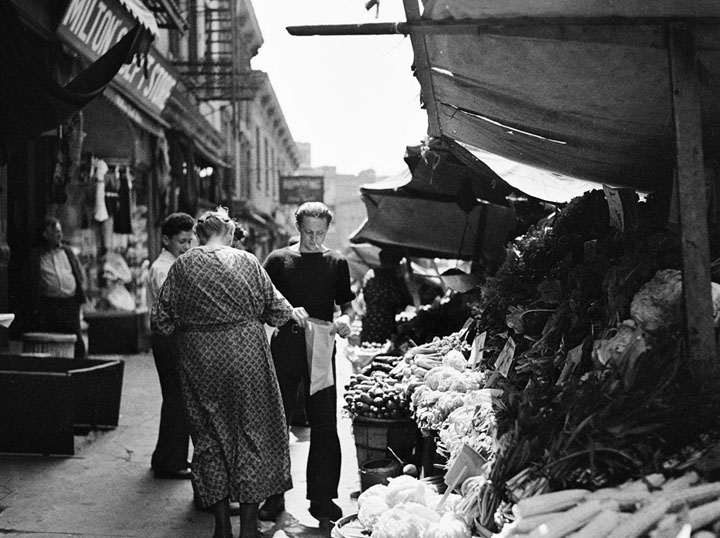 Italian vegetable sidewalk stand, on Bleeker Street, near Church of Our Lady of Pompeii, in August of 1937.