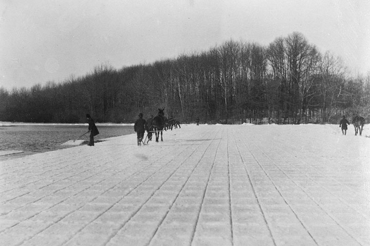 Men cut ice from Kissena Lake in Queens, ca. 1860-1900.