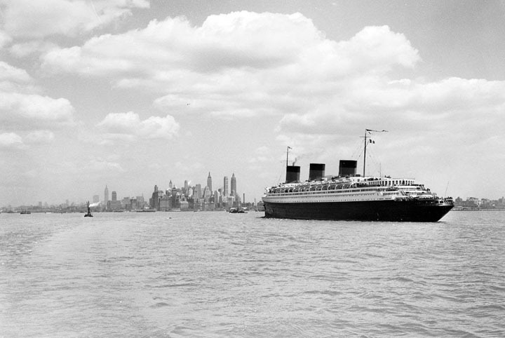 The S.S. Normandie, seen from a Staten Island ship steaming through upper bay on its way to a river pier built for it, ca. 1935-1941.
