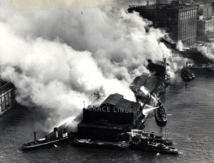 Fire Boats fight a blaze at Grace Line Pier 57, West 15th St, near the National Biscuit Co. building.
