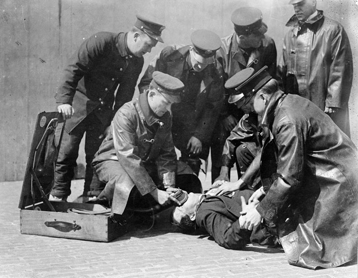 Members of the New York Fire Department attend to a fire victim.