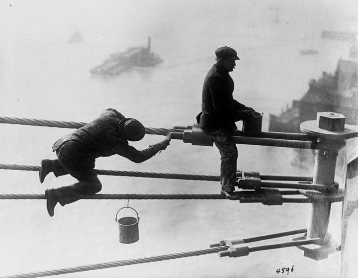 Brooklyn Bridge painters at work high above the city, on December 3, 1915.