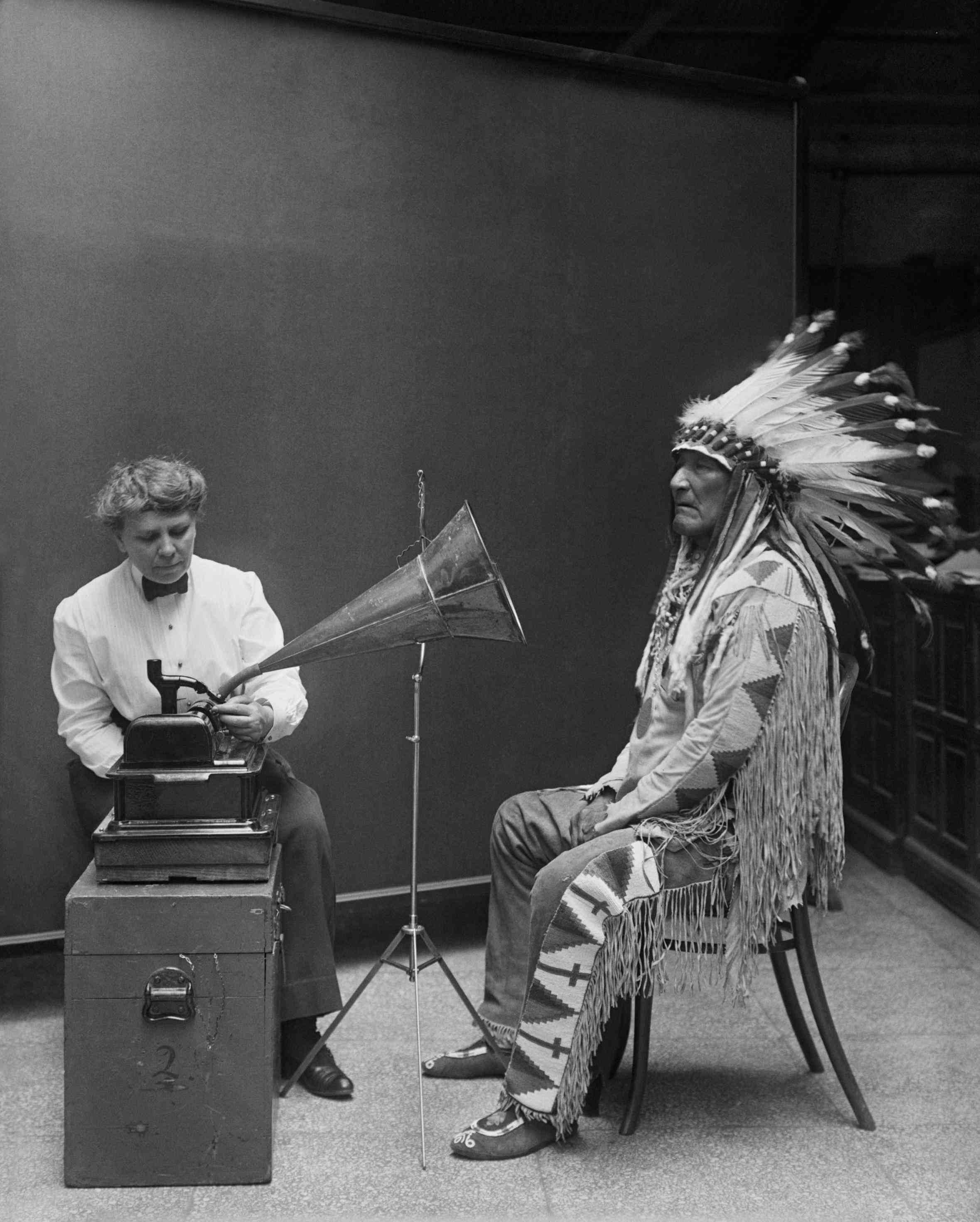 Ethnomusicologist Frances Densmore recording the music of a Blackfoot chief onto a phonograph, 1916.