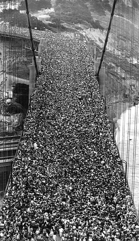 For the 50th anniversary of the Golden Gate Bridge in 1985, 300,000 people crossed it on foot.  The weight caused the bridge to sag by five feet.