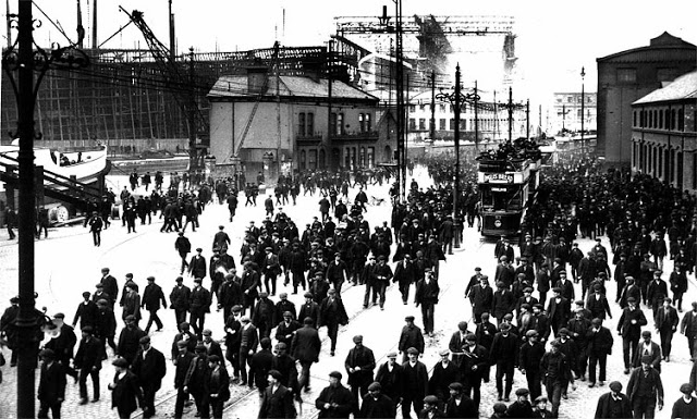 Workers leave the Harland  Wolff Shipyard in Belfast, where the Titanic was built. The ship is visible in the background of this 1911 photograph. Harland  Wolff CollectionCox Newspapers