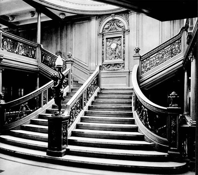 Two views of the grand staircase between the boat deck and the promenade deck aboard the RMS Titanic in undated photos. The New York Times