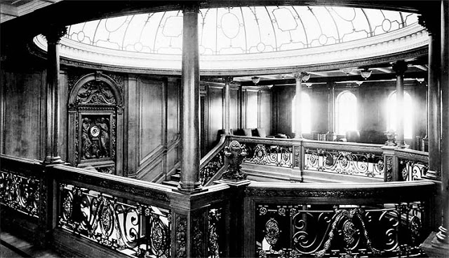 Two views of the grand staircase between the boat deck and the promenade deck aboard the RMS Titanic in undated photos. The New York Times