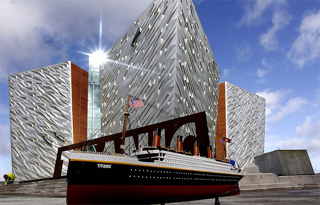 A model of the Titanic sits beside the new 160 million Titanic Belfast visitor center in Northern Ireland on March 7, 2012. The Titanic Belfast, which will open in late March, bills itself as the the worlds largest Titanic visitor experience. The center is built on a site close to the famous Harland and Wolff cranes that were used to build the Titanic, and beside the spot where the Titanic was launched in 1911. Peter MorrisonAssociated Press