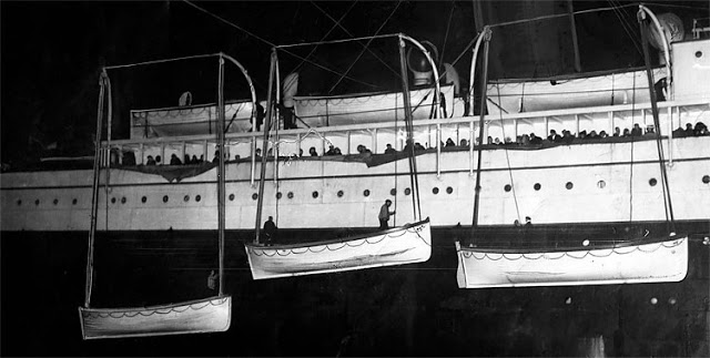 Lifeboats which carried survivors from the RMS Titanic are uploaded to the RMS Carpathia in the hours after the disaster. The New York Times