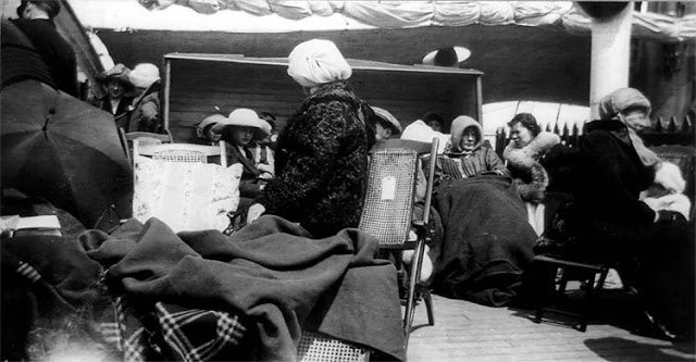 Survivors of the sinking of the RMS Titanic rest on the deck of the RMS Carpathia on April 15, 1912. The New York Times