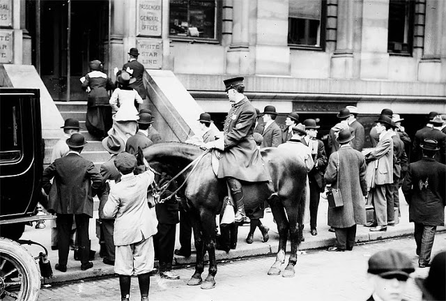 Eager to hear the latest news about the sinking of the RMS Titanic, people gather outside the offices of the White Star Line in New York on April 15, 1912. The New York Times