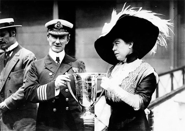 Captain Arthur Henry Rostron is presented with an award by Margaret Brown, a survivor of the RMS Titanic sinking who later came to be known as The Unsinkable Molly Brown, in this undated photo. Rostron was honored for his efforts as commander of the RMS Carpathia, which rescued many of the Titanic survivors from the north Atlantic Ocean and ferried them to safety in New York. The New York Times