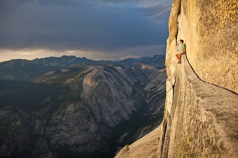 15. Half Dome, Yosemite National Park, USA Rock climber Alex Honnold sits on a ledge on the Northwest Face of Half Dome in Yosemite National Park.