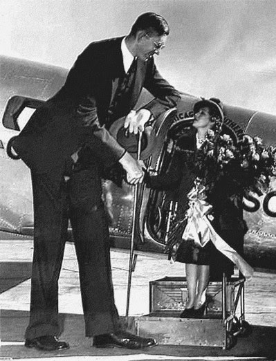 Movie star, Mary Pickford, being greeted at the St. Louis airport by Robert. At the age of 20, he got a cane because he had difficulty walking.