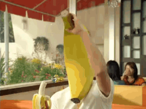 gifs - man wears a banana mask and peels it down to reveal his face