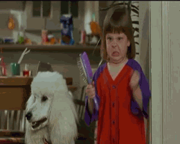 gifs - little girl waving a brush and looking angry