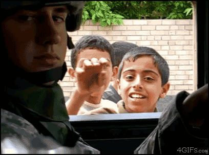 gifs - kids looking into an army vehicle