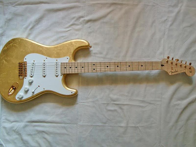 Eric Clapton Stratocaster Gold Leaf:  455,550. Guitar booked by Eric Clapton in 1996. Clapton wanted a very special guitar. The company makes custom fenders are coated with 23k gold.