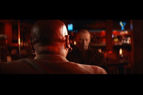 Many people believe that the band-aid on Ving Rhames' neck was an intentional choice by the filmmakers. In reality, it came from an accident Rhames had while shaving his head. When Quentin Tarantino noticed this, it inspired him to open the "Vincent Vega and Marsellus Wallace" sequence with a close-up of the band-aid instead.