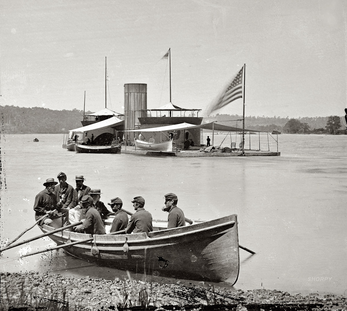 003  1864  " James River , Virginia . Double-turreted monitor U.S.S. Onondaga, soldiers in rowboat"