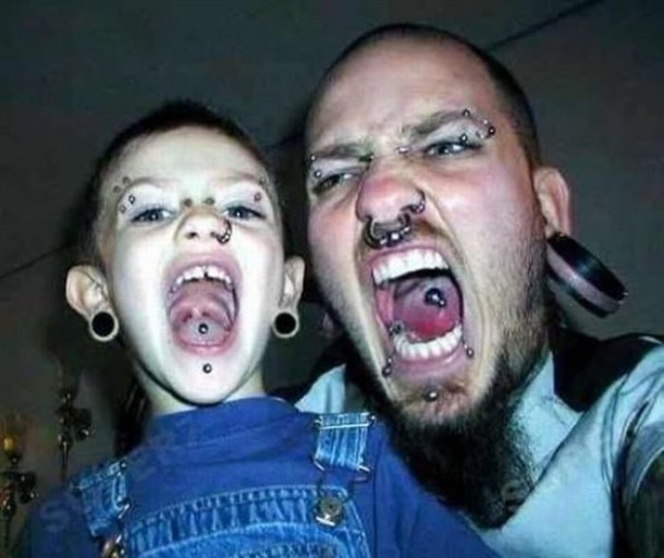   In This Picture: Photo of dad and son with piercings