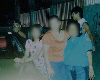 Gunman caught on "family photo" seconds before he shot a Phillipino politician taking the picture from his backyard on New Years.. 