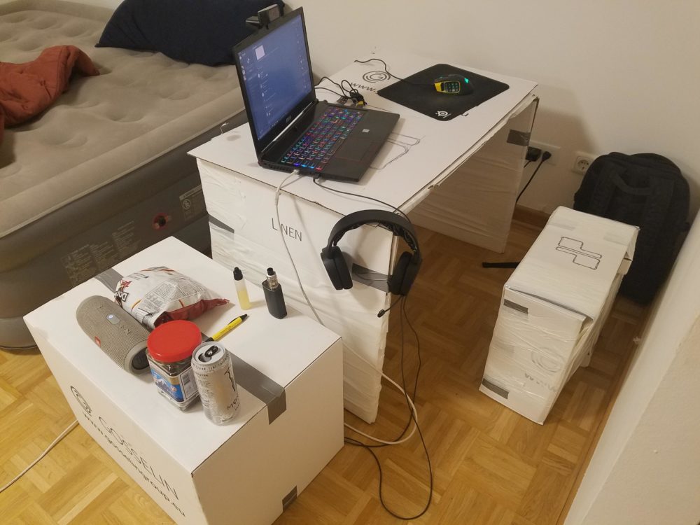 This is another example of what appears to be a decent gaming machine, but problematic setup.  Sitting on a chair made from a box and playing on a desk also made from taped up boxes is just a recipe for disaster.