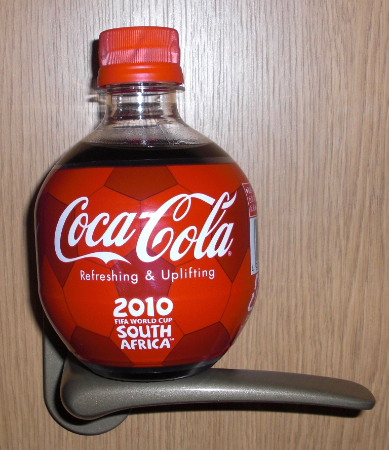 A bottle of coke that mimics a soccer ball.