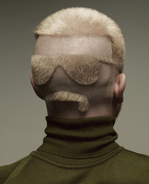 A cool guy as a haircut on the back of some1's head