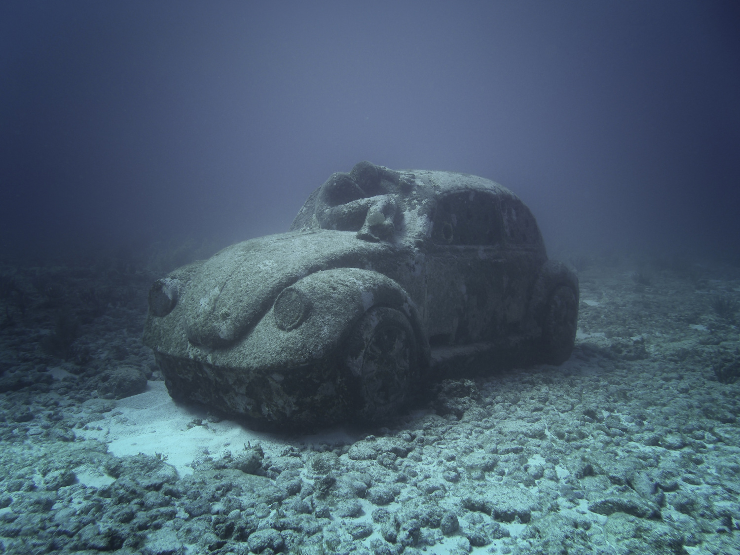Jason deCaires Taylor's cement VW beetle sculpture added to Cancun's artificial reef