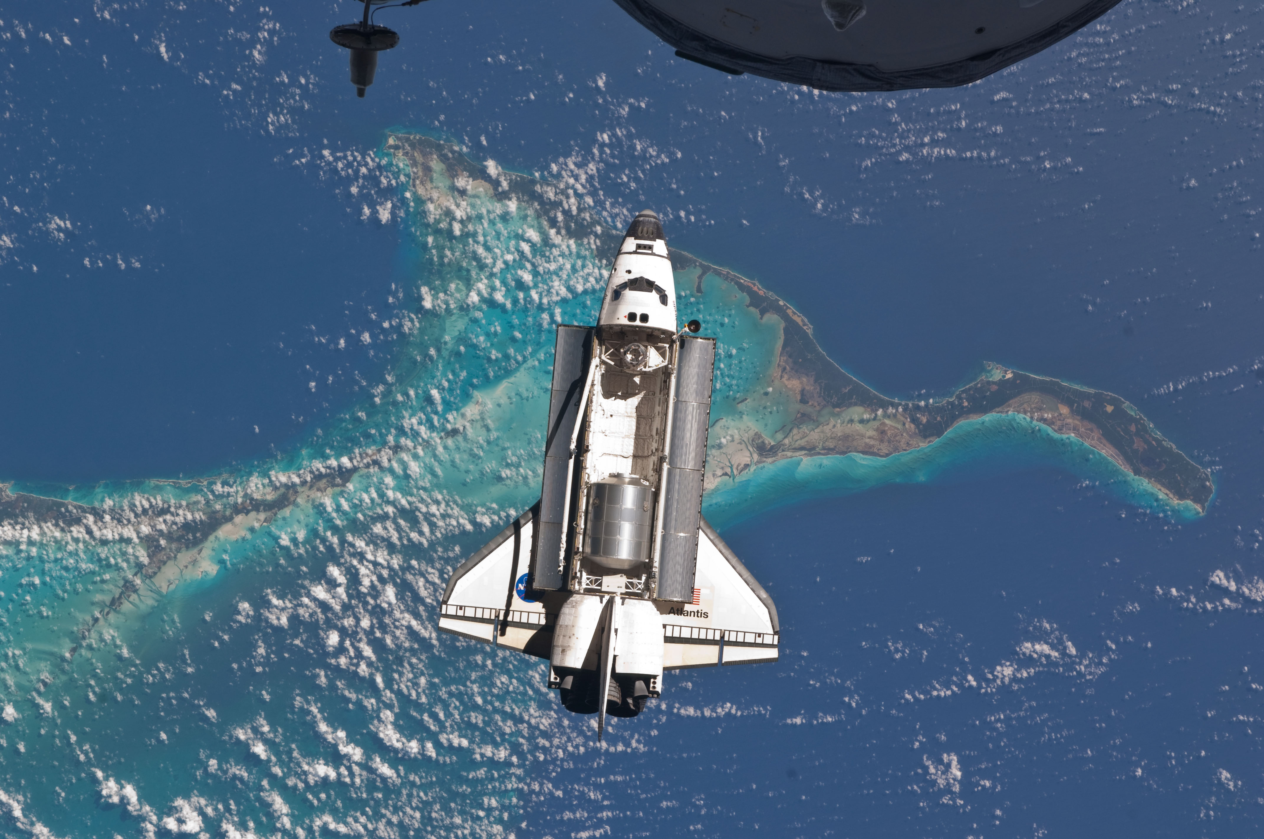 Space shuttle Atlantis over the Bahamas close to docking with the ISS, July 10, 2011