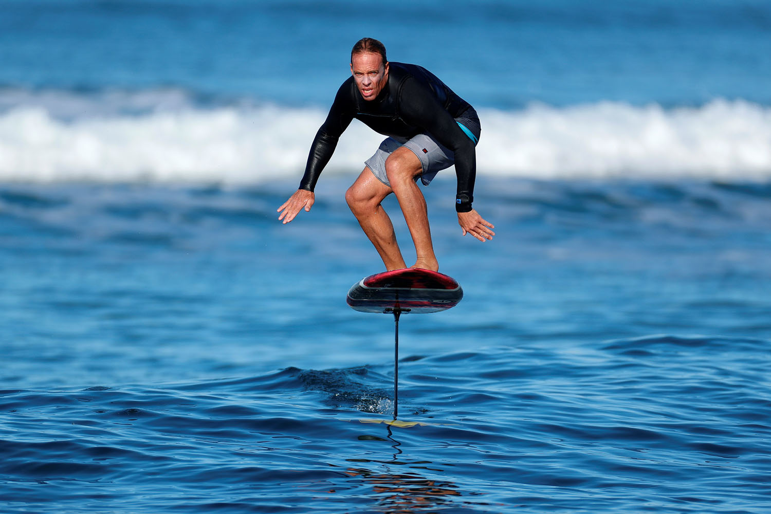 Chuck Patterson rides his foil board off the coast of Del Mar, California, February 3, 2018 (Mike Blake, Reuters)