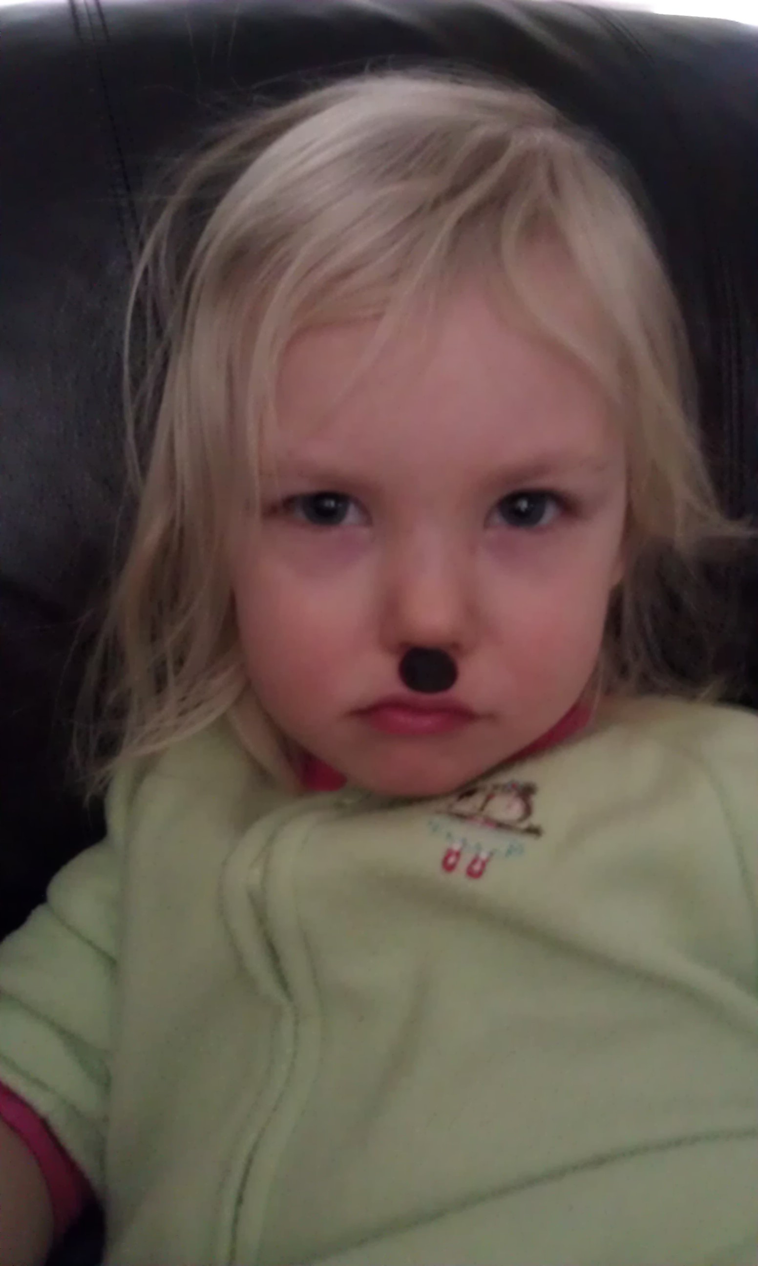 This girl is playing with raisins and looks like hitler.