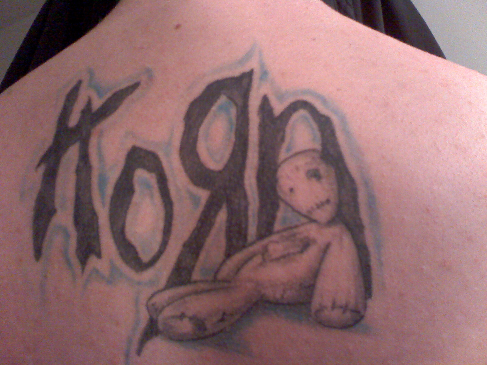 Saw the band tattoo gallery and decided to upload mine. All hand drawn with no tracing involved. Gonna eventually do something from each KoRn album on my back.