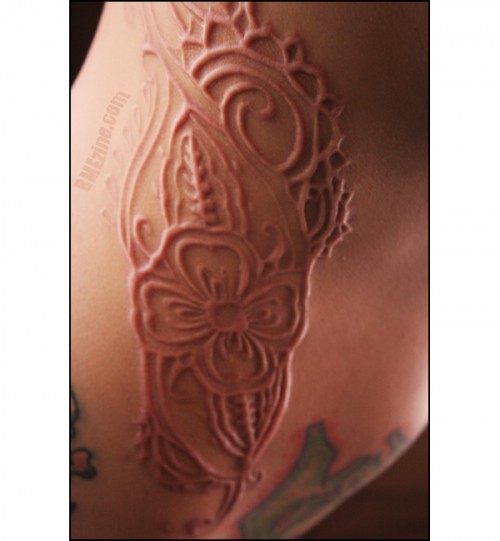 Scarification;
Another example of scarification where it gives the Art a 3D look along with texture.