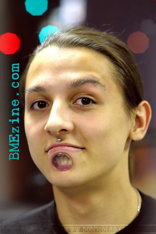 Lower Facial Labret Piercing.
One of the Newest body modifications fads to surface. Commonly seen in earlobes, this new trend takes Labrets to the Next level.